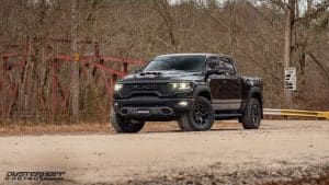 ram trx with a red steel bridge in the background