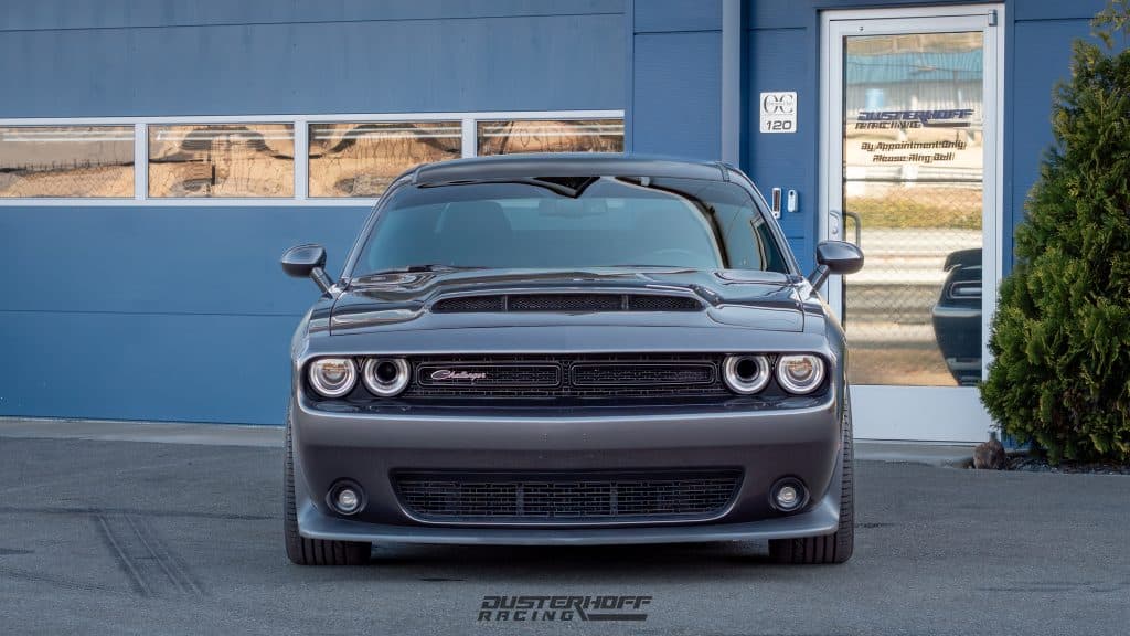 engine bay of T/A Grey Challenger showing off jlt cai and blueprint intake manifold