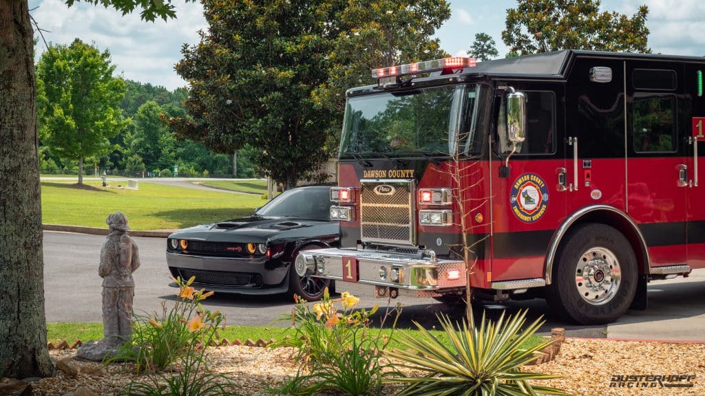 black hellcat froma  firefighter next to a Dawsonville Georgia fire truck 