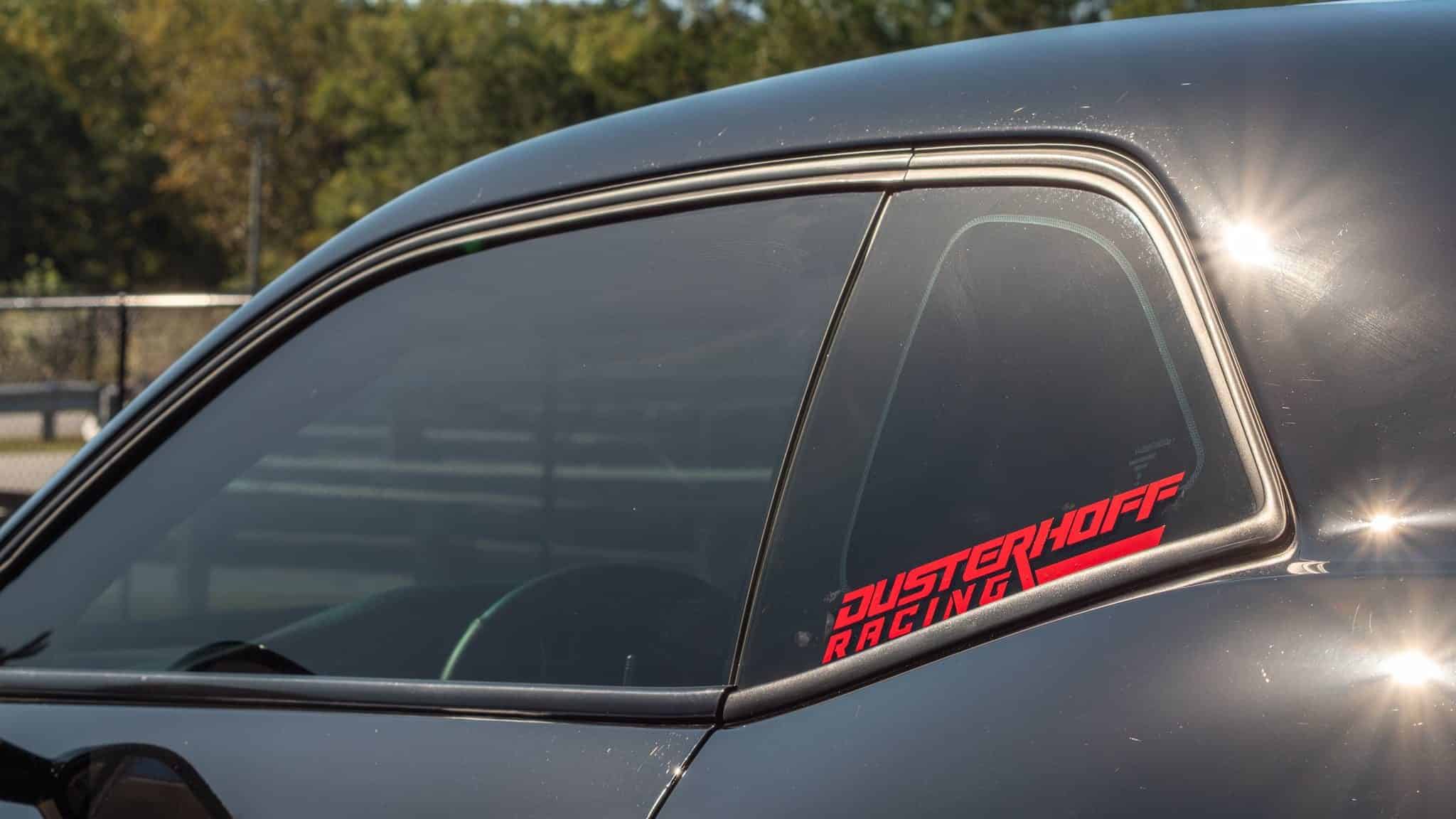Dusterhoff Racing window decal on black challengers rear quarter panel window